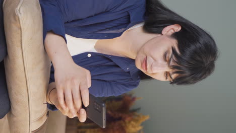 Vertical-video-of-The-woman-who-gets-angry-and-upset-at-the-incoming-phone-message.